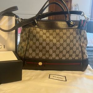 Gucci crossbody with hand strap. Brown with red and green bow accent.